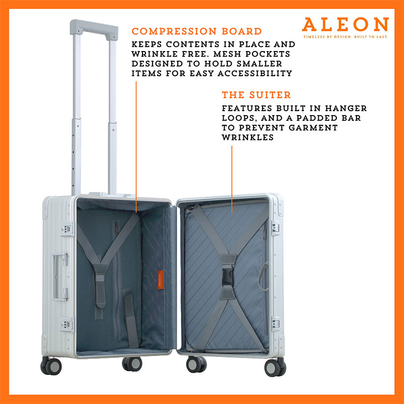 ALEON silver Carry-On with Suiter open to reveal a thoughtfully designed interior, featuring compression straps, a zippered divider, and a fold-out suiter for wrinkle-free garment storage.