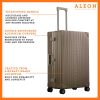 3055-BR---B07MHX8VSH--side-1-(1) ALEON Bronze Macro Traveler Checked Case in brushed aluminum finish, standing upright with reinforced corners and dual lock latches, showcasing its sleek and durable design.