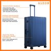 3255-SA-B077WTYDM1-side-1-(1) The ALEON 32″ Macro Plus Traveler Large Check-In, crafted from aircraft-grade aluminum, stands upright on a pristine hotel lobby floor. Its hard-shell design, reinforced corners, and TSA-approved locks emphasize security and durability for long-haul journeys.