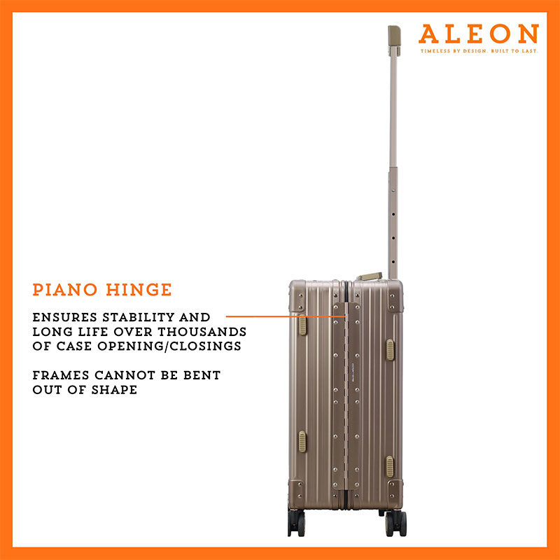 The ALEON 21" bronze Carry-On glides effortlessly through a busy terminal, its precision-engineered wheels navigating the polished flooring with ease. The sturdy telescoping handle ensures a comfortable grip for travelers.