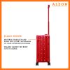 B07499SXCK-RU-Hinge-(2) A polished red ruby aluminum ALEON 21" Carry-On stands upright on a glossy airport floor, reflecting ambient lighting. Its durable, hard-shell construction and smooth wheels embody modern travel efficiency.