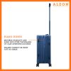 B074B3S7K8-SA-Hinge-(2) The ALEON 21" blue sapphire Carry-On rests beside a plush airport lounge chair, its refined metallic finish complementing the sophisticated travel setting. Designed for durability and elegance, it exudes premium craftsmanship and functionality.