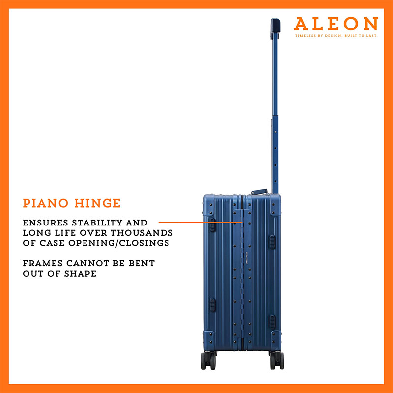 The ALEON 21" blue sapphire Carry-On rests beside a plush airport lounge chair, its refined metallic finish complementing the sophisticated travel setting. Designed for durability and elegance, it exudes premium craftsmanship and functionality.