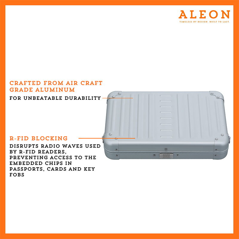 Aleon large platinum silver crossbody bag featuring interior RFID-blocking pockets for secure storage. The bag is open, showcasing multiple organized compartments designed to protect personal items such as cards and passports. Aleon logo and tagline 'Timeless by design. Built to last.' are displayed in the top right corner.