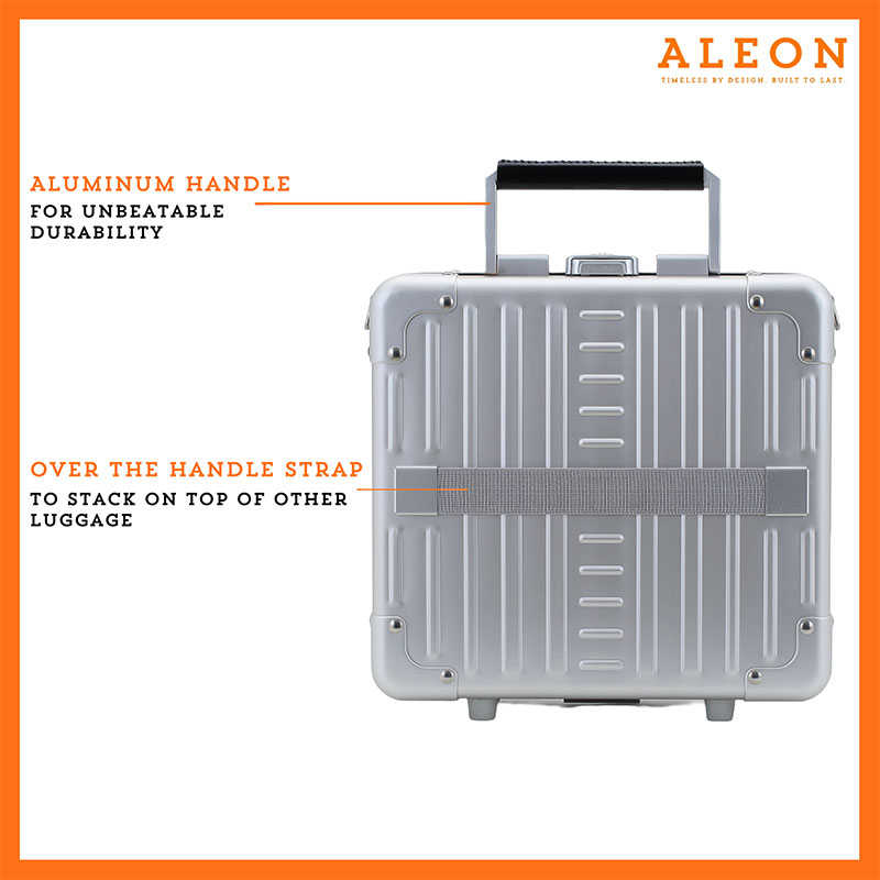 2612-PL-back The image showcases the ALEON Platinum silver Messenger Case, designed with an aluminum handle for unbeatable durability. It features an over-the-handle strap for effortless stacking onto rolling luggage. The silver case has a sleek, ribbed design with reinforced corners, offering a balance of style and security. The ALEON logo and tagline, "Timeless by design. Built to last." are displayed in the top right corner.